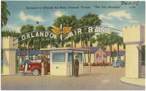 Vintage postcard of the gated entrance to the Orlando Air Base with palm trees
